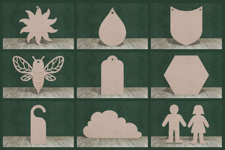 Selection of mdf craft blanks on a green background