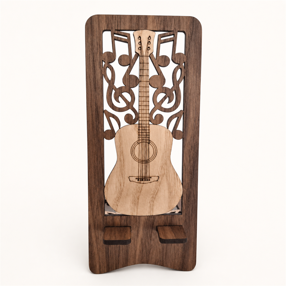 A wooden guitar-shaped phone holder with a dark brown walnut wood frame, laser-cut musical notes and guitar design in the center, showing the two tabs that the phone sits on. Shown on a plain light background.