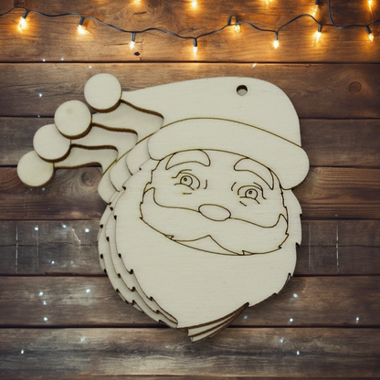 wooden shape of Santa with face details etched on the surface on a wood background with some Christmas lights