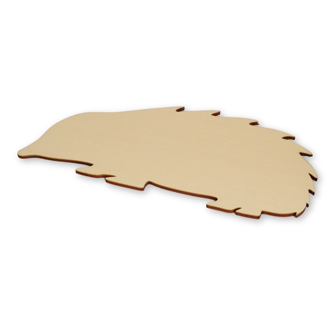wooden hedgehog shape laying at an angle on a white background