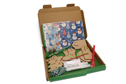 Box with craft items to make your own wooden present tag