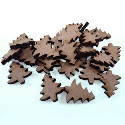 Mini Christmas tree cut-outs on a light green background