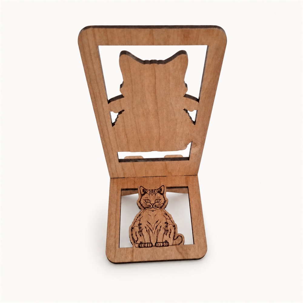 Back of wooden phone stand, featuring a large cat silhouette cutout on the upper panel and a smaller laser-engraved cat figure on the lower panel, shown on a light gray background.