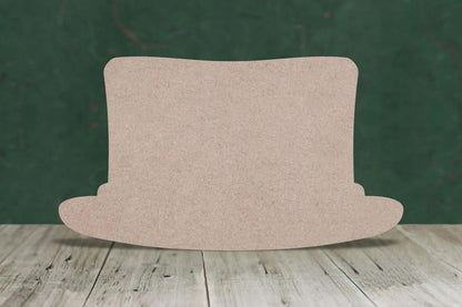 Mdf top hat cut-out on a wooden floor with a green background