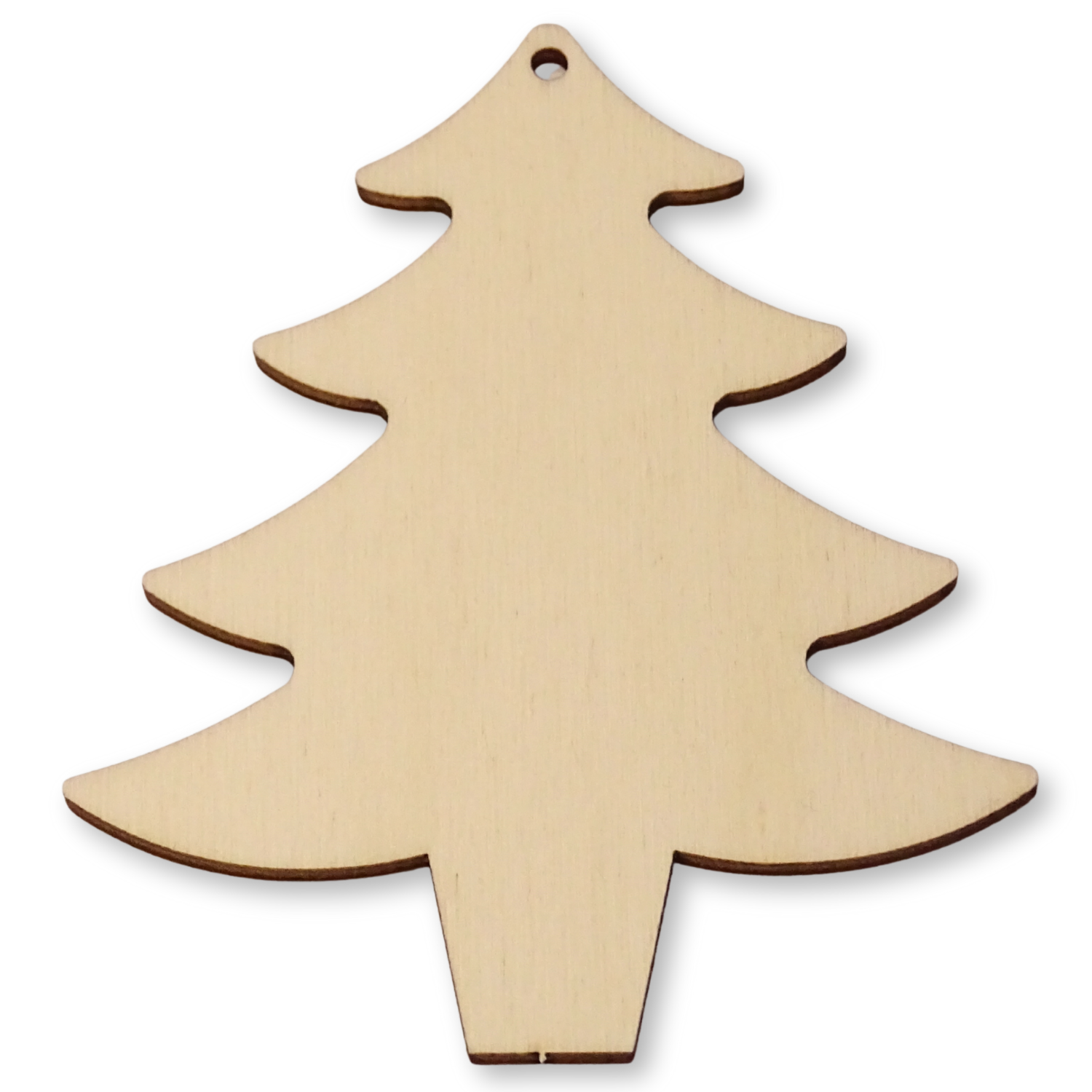 Christmas tree shape cut from plywood on a white background showing the hole position.