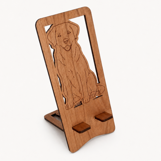 A wooden phone stand with an engraved Labrador design, shown on a clean white background.